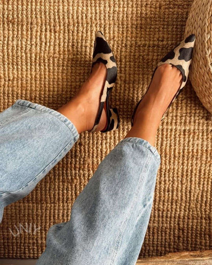 talons larges classiques slingback à bout effilé et imprimé vache.